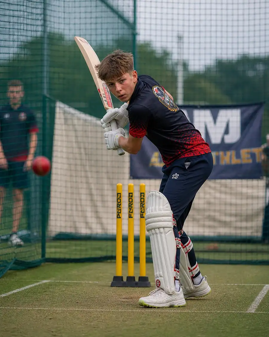 UWSM cricket player batting in training nets Singapore